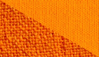 Close-up of fabric in orange color, dyed using Aybel egg-yolk yellow fabric dye.